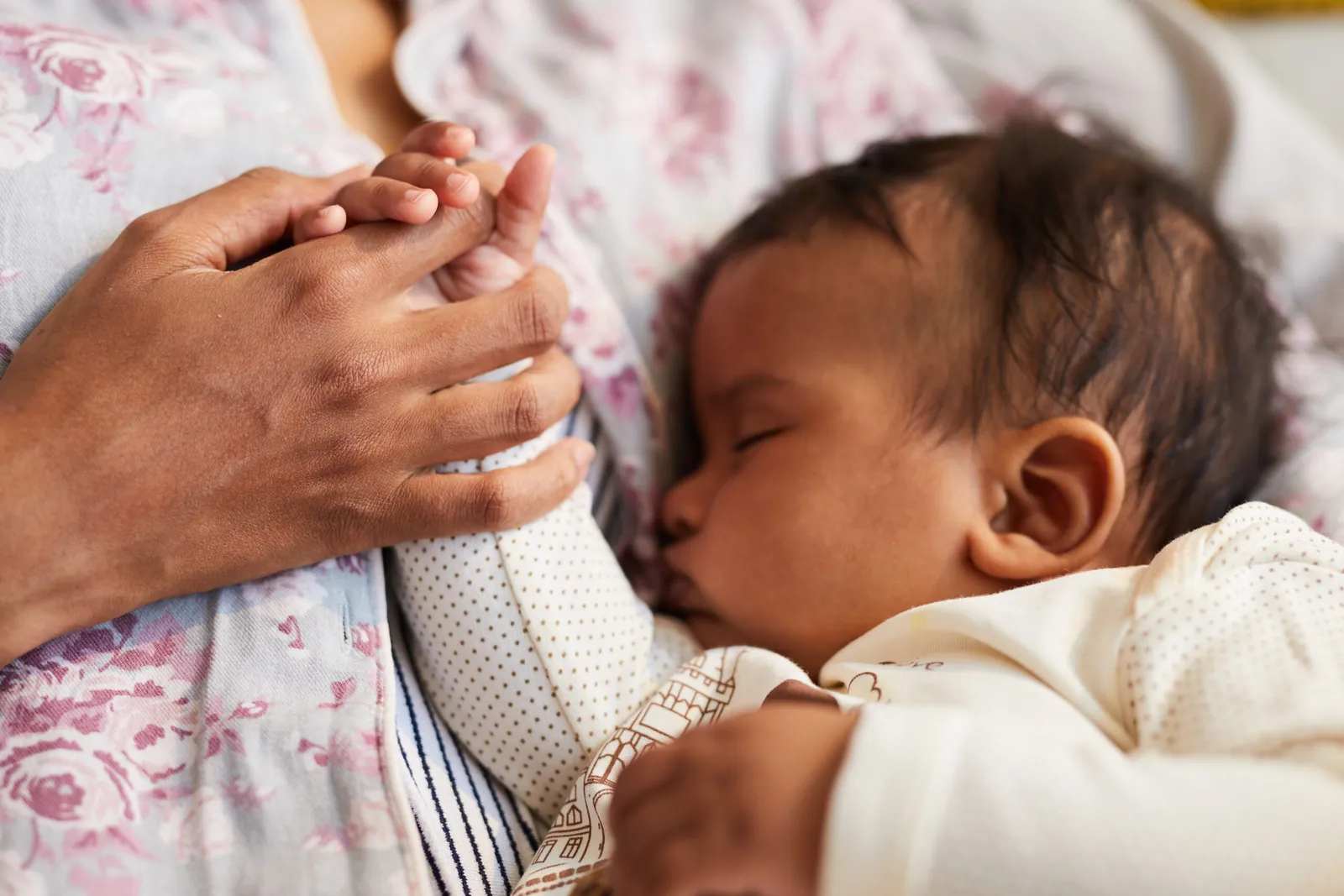 Newborn baby resting on mother's chest