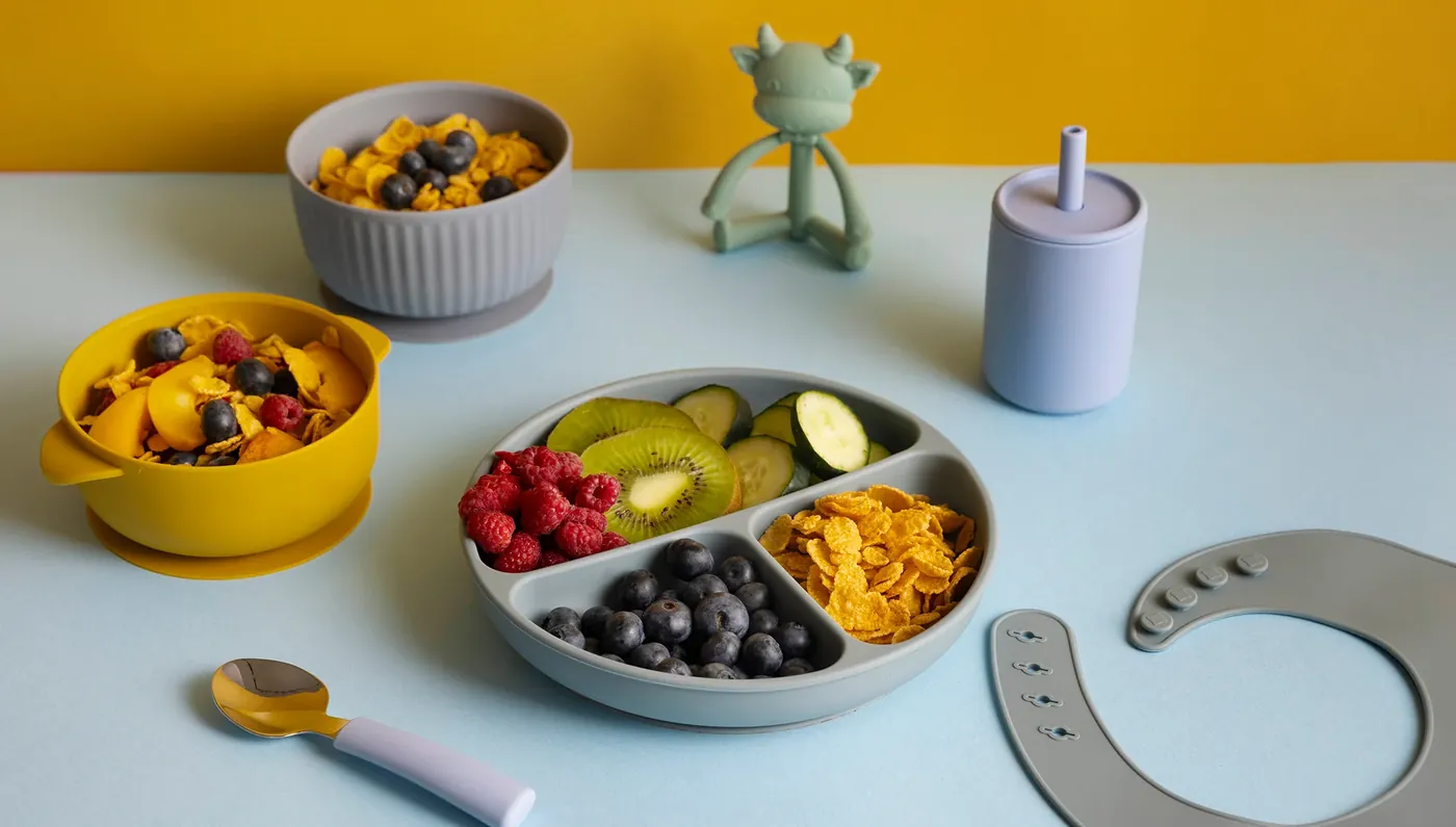 A baby's plate of fruit, vegetables and grains