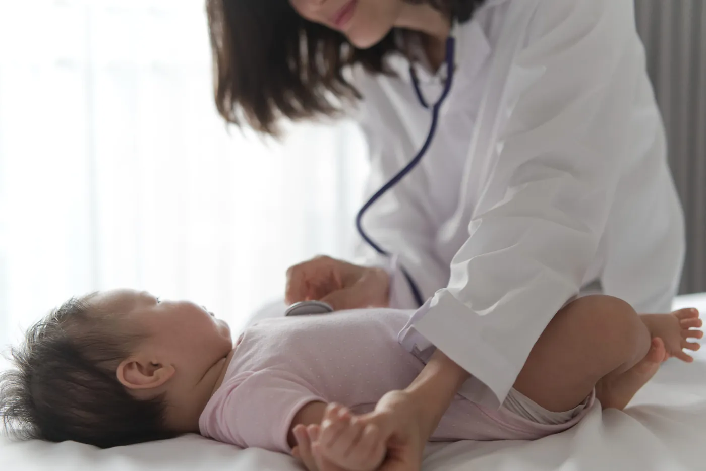 Newborn baby being gently checked