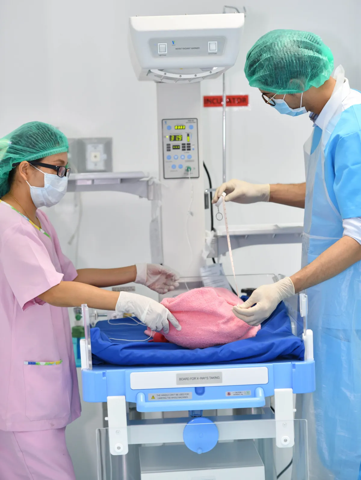 Hospital team caring for a newborn